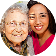 young woman and senior woman smiling
